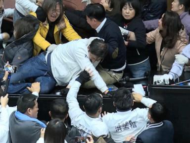 Taiwan lawmakers clash after one party breaks into legislature to occupy speaker's chair