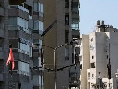 AP PHOTOS: An AP photographer captures a bomb falling on a building in his childhood neighborhood