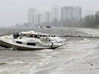 Australian homes lose power and people told to evacuate as tropical cyclone approaches