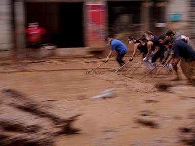 AP PHOTOS: Death by water, burial by mud. Images of Spain's floods of the century