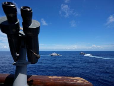 Philippine forces retake an island in mock combat as China's navy watches