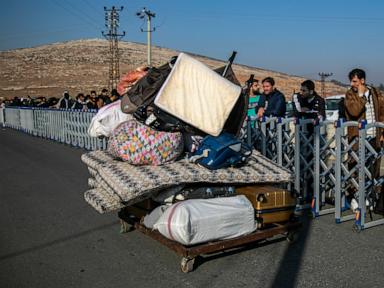 Hundreds of Syrians line up at Turkish border crossings as Erdogan expects more to go home