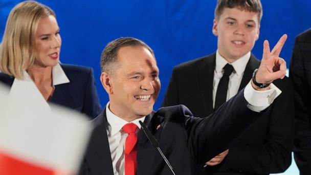 Presidential candidate Karol Nawrocki, a conservative historian backed by the right-wing Law and Justice party greets supporters as he arrives at his headquarters after the presidential election runoff in Warsaw, Poland, Sunday, June 1, 2025. (AP Photo/Czarek Sokolowski)