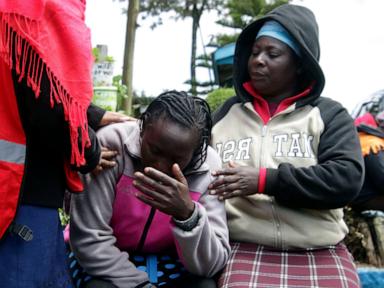 Kenyan officials remove bodies as they try to confirm the death toll from a school dormitory fire