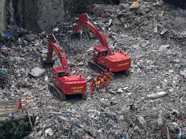Rescuers in China search the rubble for survivors of landslide that killed 8 and left 34 missing