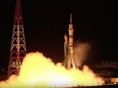 A Soyuz craft with 2 Russians and 1 American docks at the International Space Station