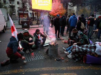 Protesters in Georgia's capital set up a tent camp on the main street and call for new elections