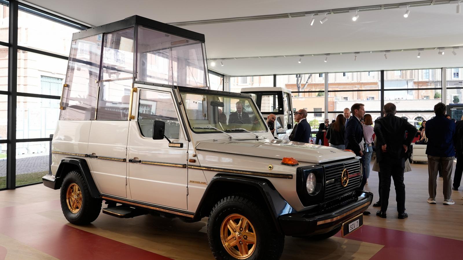 A popemobile exhibition is unveiled at the Vatican, featuring the vehicle popes have used since 1930