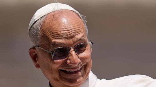 Pope Leo XIV smiles while leaving after his weekly general audience in St. Peter's Square at The Vatican, Wednesday, May 28, 2025. (AP Photo/Gregorio Borgia)