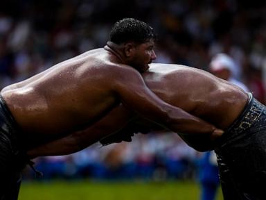 AP PHOTOS: Oil wrestlers battle for the title in a more than 600-year-old competition in Turkey