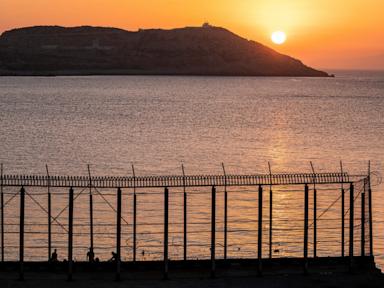 Hundreds of migrants swim from Morocco to Spain’s Ceuta as border security is strained