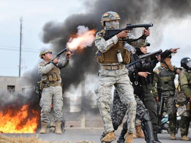 Bolivia protesters clash with police after president signs law for harsher crackdown
