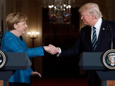 German ex-leader Merkel says she felt sorrow at Trump's comeback and recalls awkward non-handshake