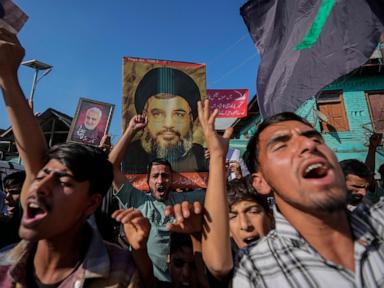 Middle East latest: A Hamas official is killed in an Israeli strike on a refugee camp