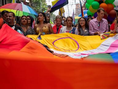 Same-sex couples and LGBTQ+ activists rally in Nepal's capital during the annual Pride parade