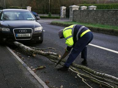 A fierce storm is lashing Ireland and Scotland with record winds, downing power lines