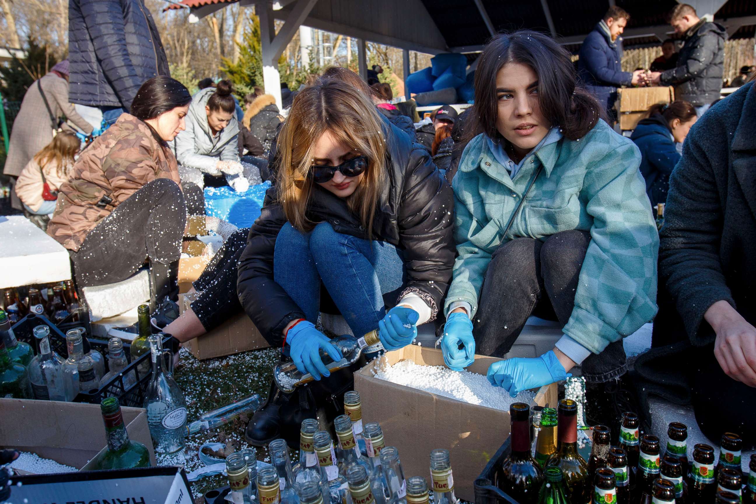 PHOTO: Local residents prepare Molotov cocktails to be sent to the frontline, Uzhhorod, Zakarpattia Region, western Ukraine, on Feb. 27, 2022.