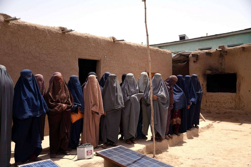 PHOTO: Afghan women work at a shampoo and soap factory in Kandahar, July 30, 2022. 