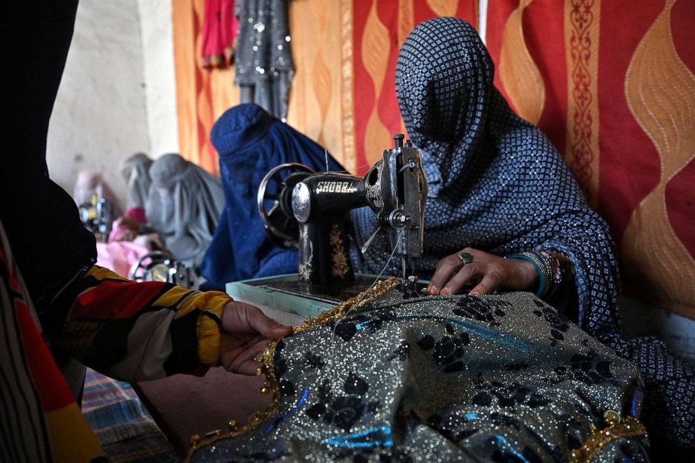 PHOTO: Afghan women work in a garments factory in Kandahar, on July 30, 2022.