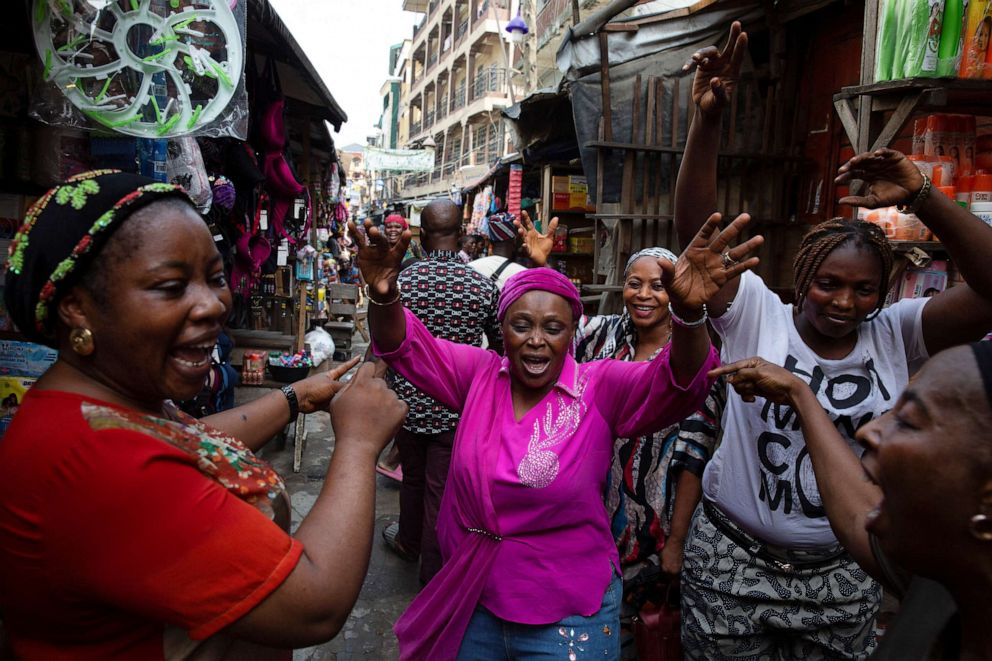 PHOTO: Women dance at a market in Lagos, Nigeria, on March 1, 2023, in celebration of Bola Tinubu's victory in the country's presidential election.