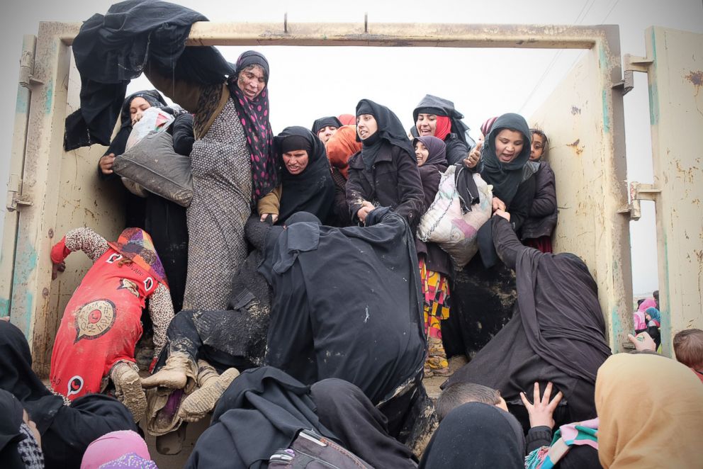 PHOTO: A group of Iraqi women are fleeing IS attacks during the siege of Mosul.