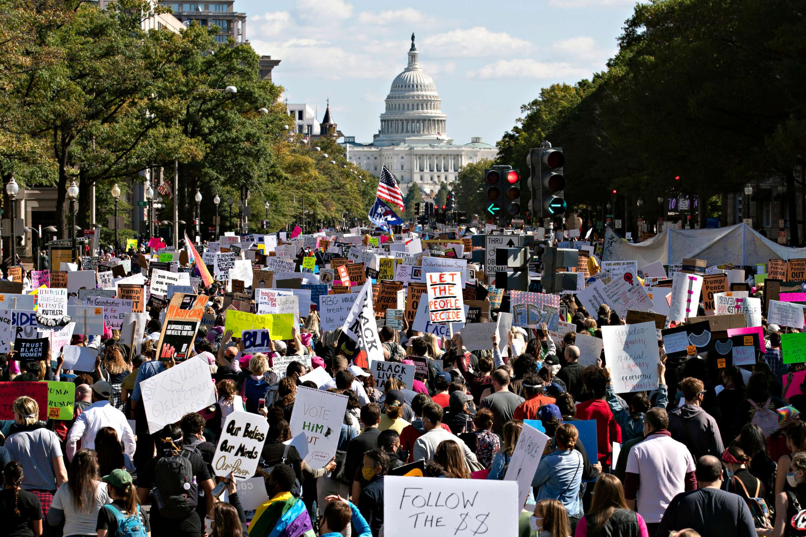 PHOTO: With the U.S Capitol in the background, demonstrators march on Pennsylvania Av. during the Women's March in Washington, Oct. 17, 2020.