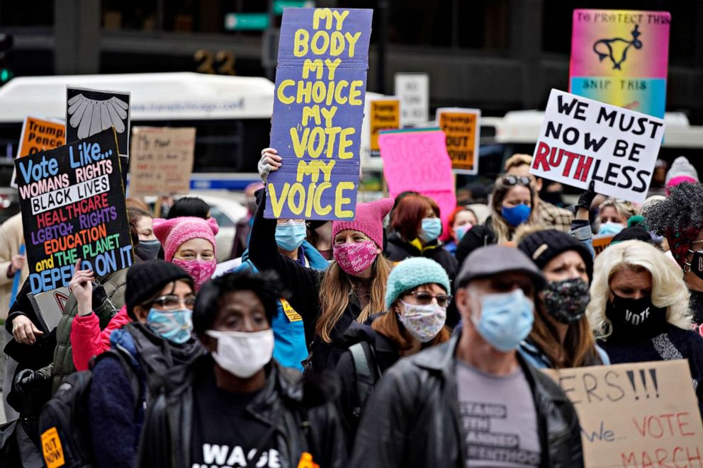 PHOTO: People march during the Women's March in downtown Chicago, Oct. 17, 2020.