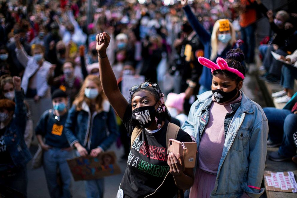 PHOTO: People take part in the 2020 Women's March next to the New York Stock Exchange in New York City, Oct. 17, 2020.