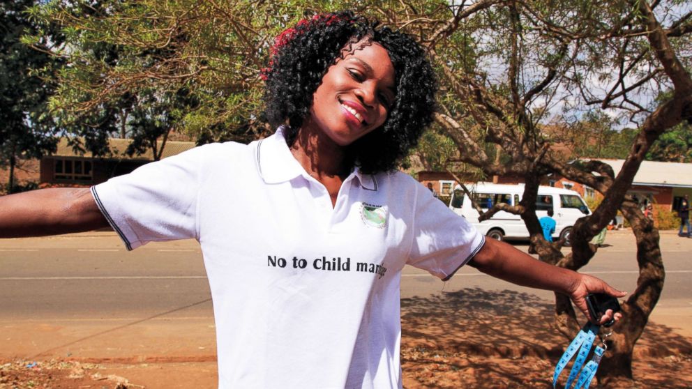 PHOTO: Joyce Mkandawire, co-founder of Girls Empowerment Network (GENET), wears a t-shirt that the girls used to promote their campaign against child marriage, in Malawi.
