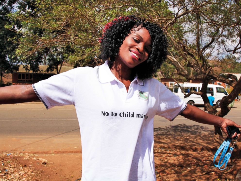 PHOTO: Joyce Mkandawire, co-founder of Girls Empowerment Network (GENET), wears a t-shirt that the girls used to promote their campaign against child marriage, in Malawi.