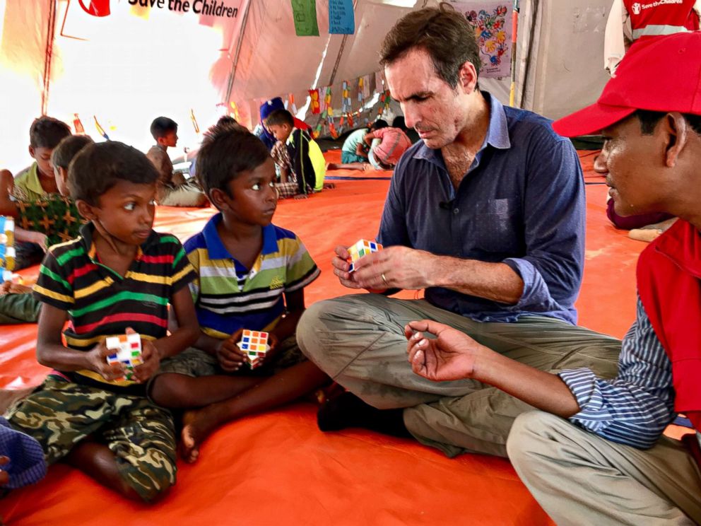 PHOTO: ABC News' Bob Woodruff plays with Rohingya children at one Save the Children site in Bangladesh. Mark Pierce, Save the Children's country director for Bangladesh, not shown, told ABC News the Rohingya crisis was really "a children's crisis."