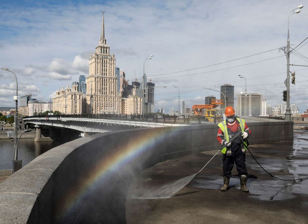 PHOTO: A specialist sprays disinfectant while sanitizing a bridge amid the outbreak of the novel coronavirus in Moscow, Russia, on May 16, 2020.