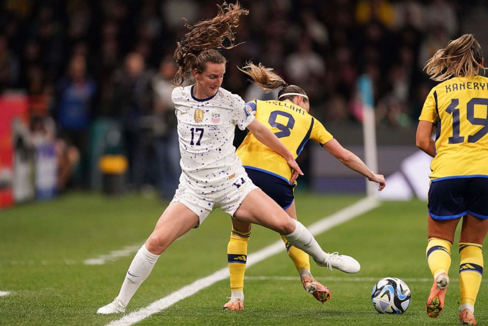 PHOTO: United States' Andi Sullivan, left, and Sweden's Kosovare Asllani, center, compete for the ball during the Women's World Cup Round of 16 soccer match in Melbourne, Australia, Sunday, Aug. 6, 2023.