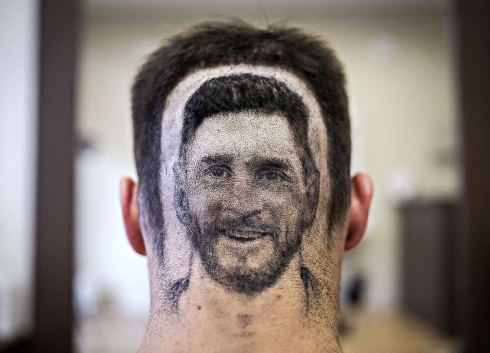 PHOTO: A soccer fan sports a hair tattoo showing the portrait of Argentinian football player Lionel Messi at a hair salon in Novi Sad, Serbia on June 10, 2018.