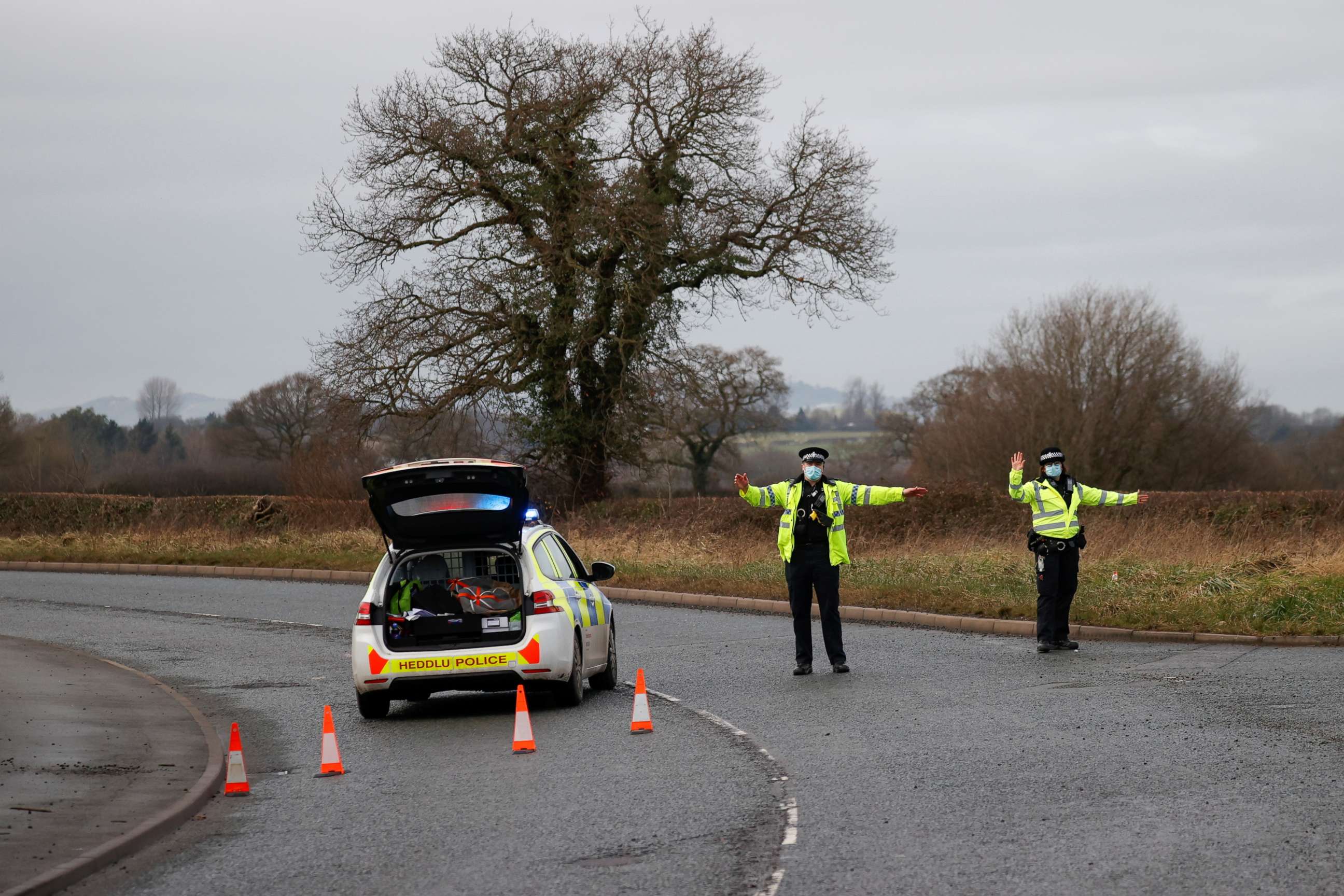 PHOTO: Police officers manage a checkpoint on a road near the Wockhardt pharmaceutical plant in Wrexham, Britain January 27, 2021.