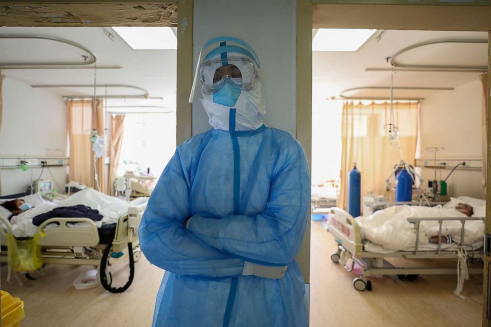 PHOTO: A medical worker in a protective suit takes a break at an isolated ward of Wuhan Red Cross Hospital in Wuhan, Hubei province, China, the epicenter of the novel coronavirus outbreak, Feb. 16, 2020.