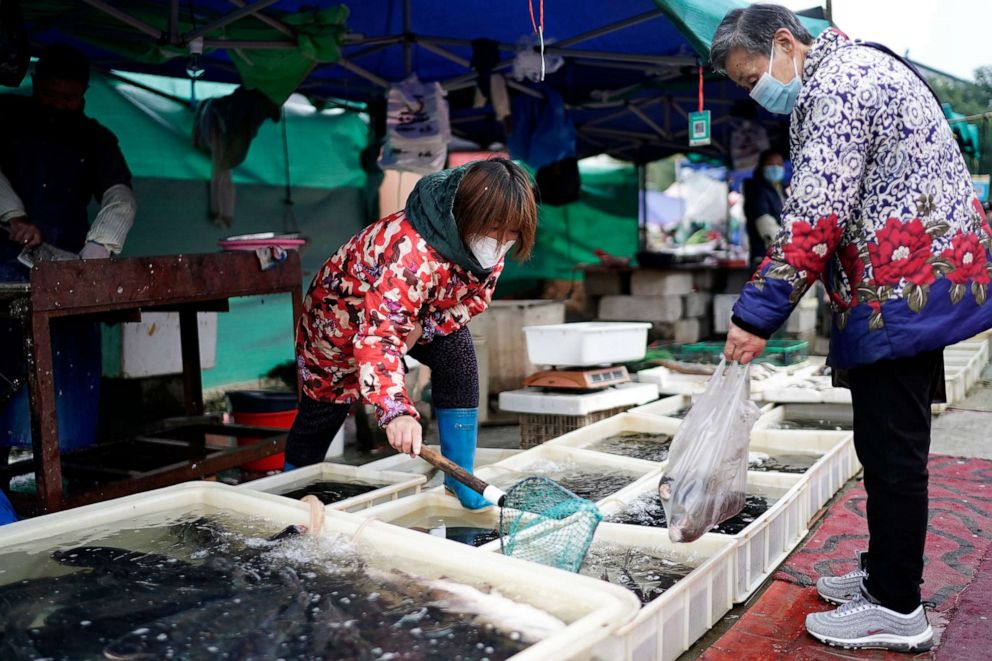 PHOTO: Vendors are selling fish in an open market on December 2, 2020 in Wuhan, Hubei province, China.