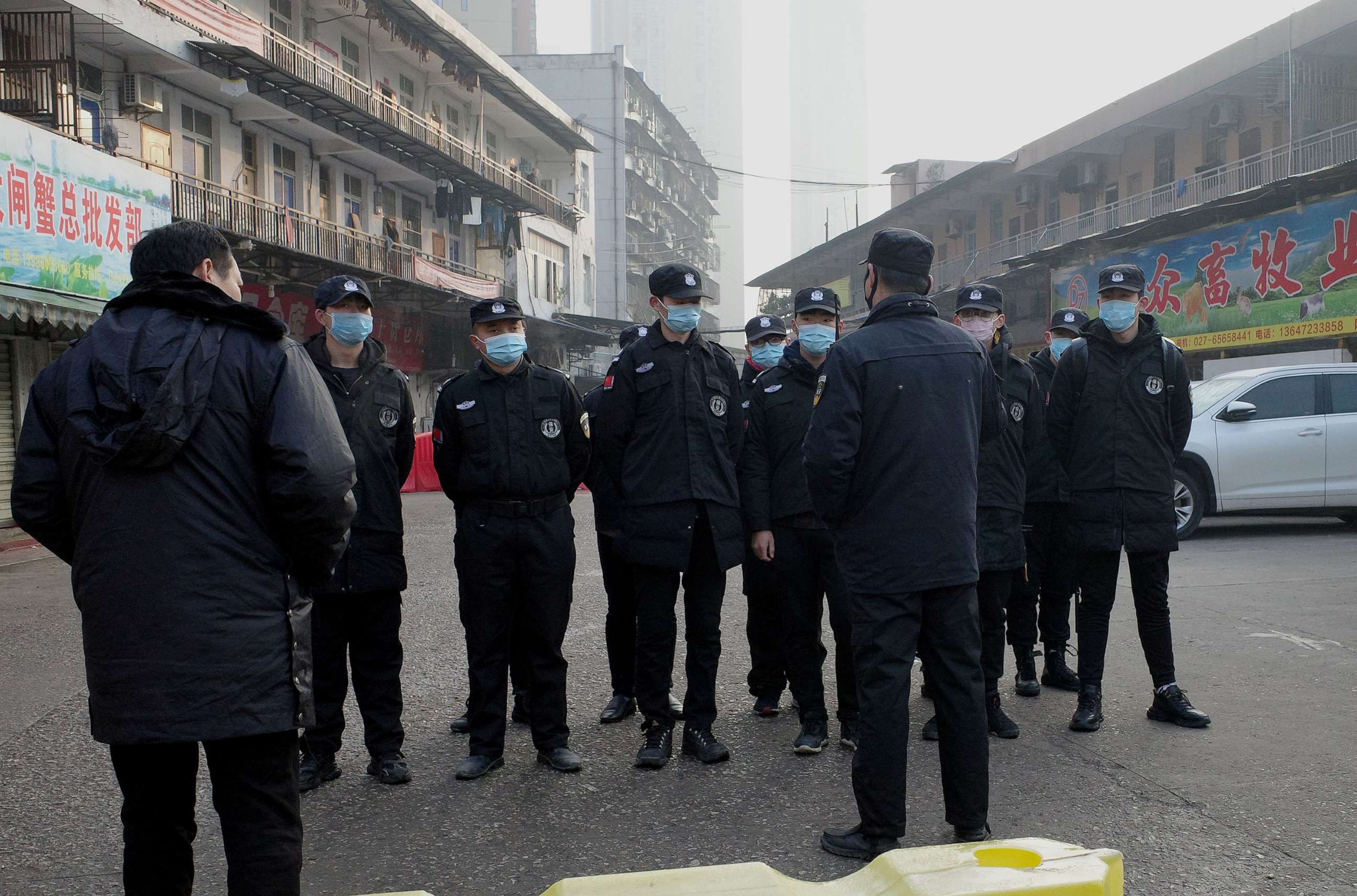 PHOTO: Security guards stand in front of the closed Huanan wholesale seafood market, where health authorities say a man who died from a respiratory illness had purchased goods from, in the city of Wuhan, Hubei province, Jan. 12, 2020.