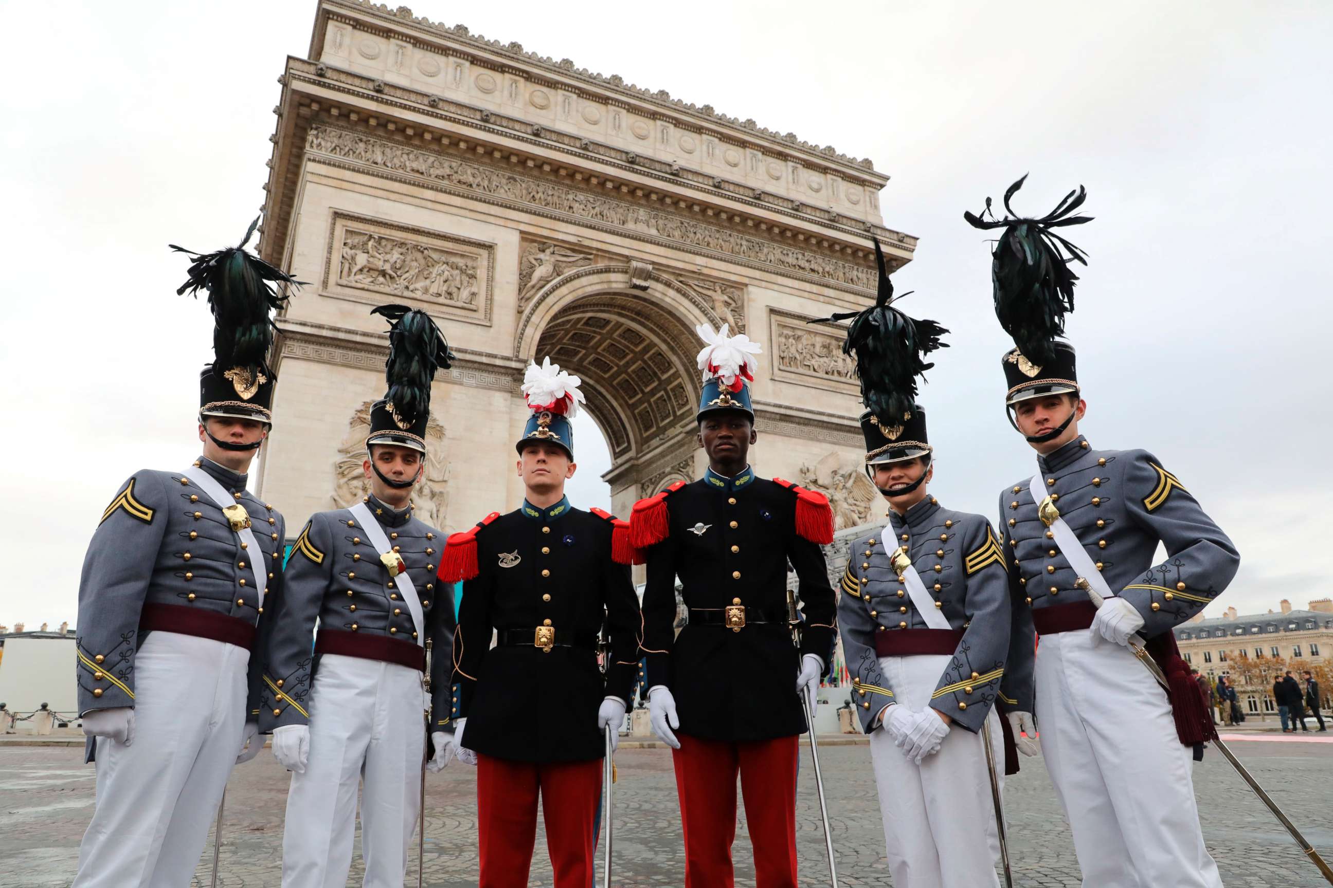 PHOTO: Saint-Cyr cadets, center, pose with West Point cadets ahead of a ceremony at the Arc de Triomphe in Paris, as part of commemorations marking the 100th anniversary of the Nov. 11, 1918, armistice, ending World War I, Nov. 11, 2018. 