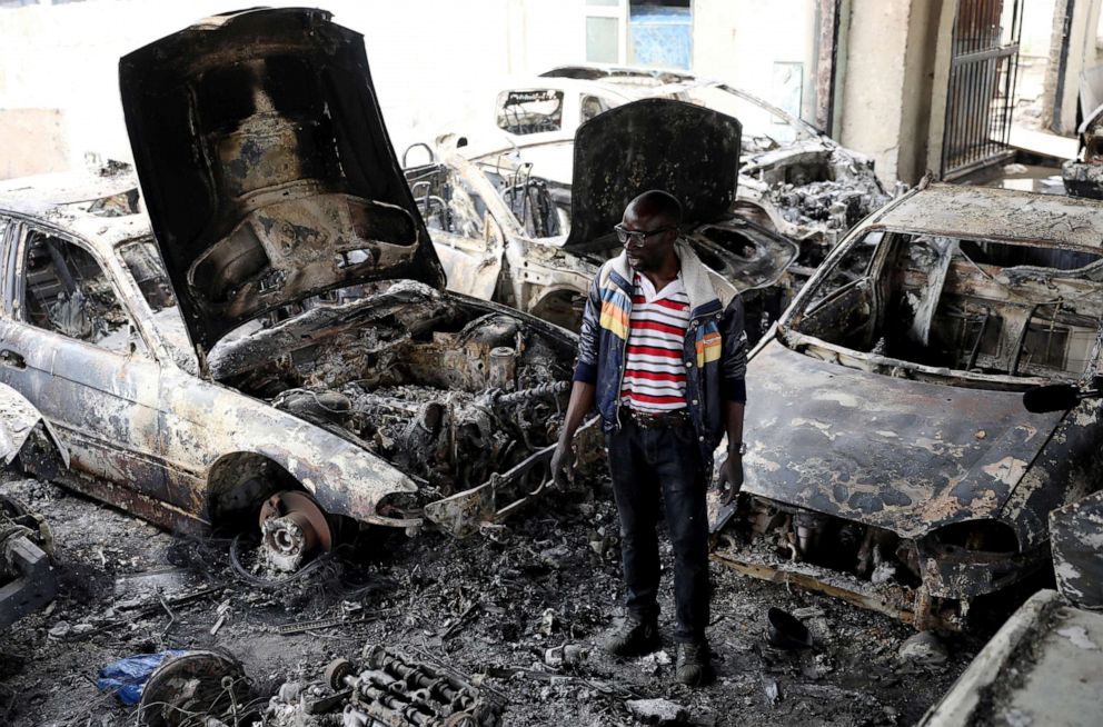 PHOTO: Nigerian entrepreneur Basil Onibo, one of the victims of the latest spate of xenophobic attacks looks at the burnt out cars at his dealership in Johannesburg, South Africa, Sept. 5, 2019.