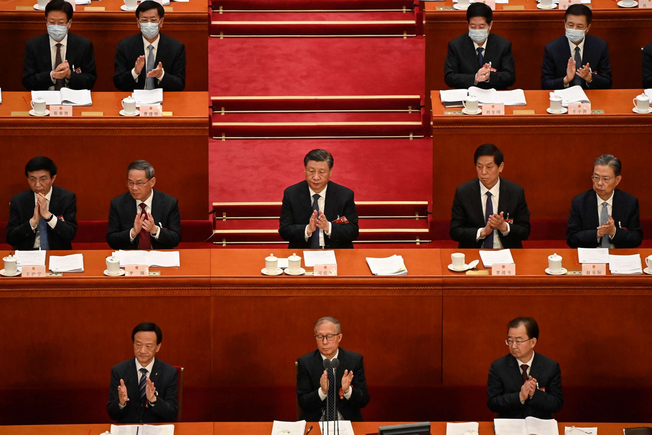 PHOTO: Politburo Standing Committee members, including President Xi Jinping, applaud during the second plenary session of the National People's Congress at the Great Hall of the People in Beijing on March 7, 2023.