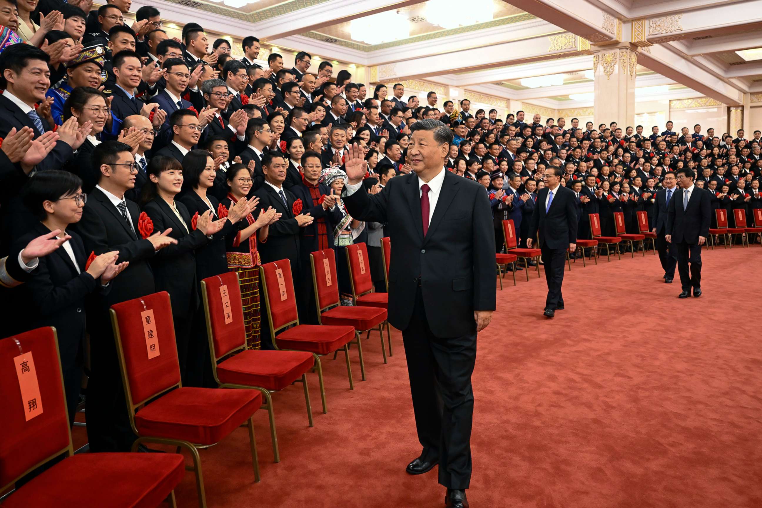PHOTO: Chinese President Xi Jinping, center, and his premier Li Keqiang, center right, meet with representatives of model civil servants during a national award ceremony held at the Great Hall of the People in Beijing, Aug. 30, 2022. 