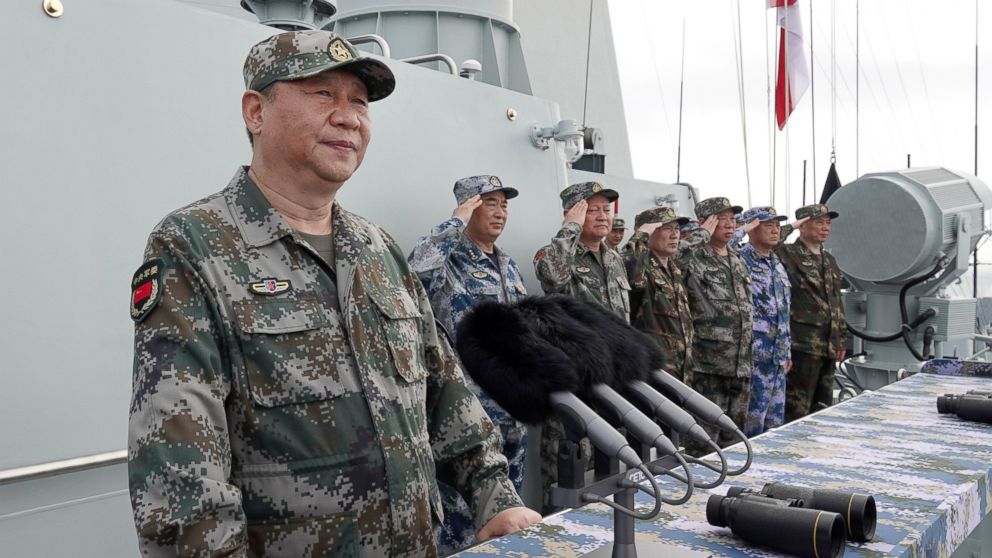  In this April 12, 2018, file photo released by Xinhua News Agency, Chinese President Xi Jinping speaks after reviewing the Chinese People's Liberation Army (PLA) Navy fleet in the South China Sea. 