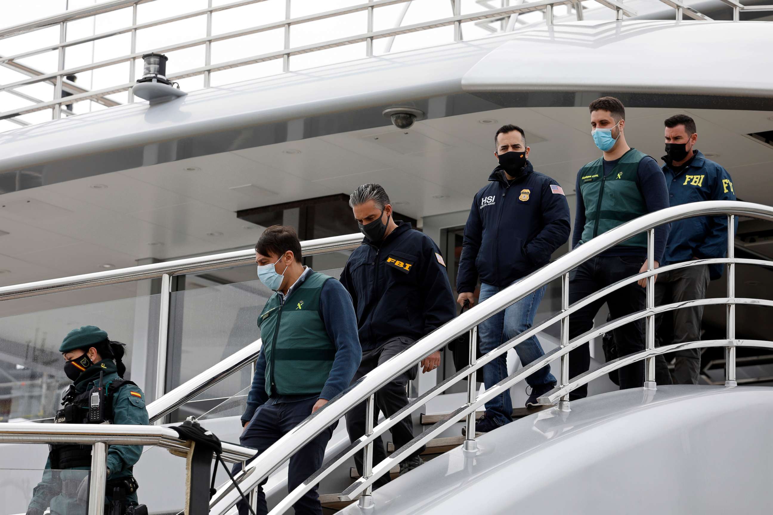 PHOTO: Civil Guards accompany U.S. FBI agents and a U.S. Homeland Security agent from the yacht called Tango in Palma de Mallorca, Spain, April 4, 2022.