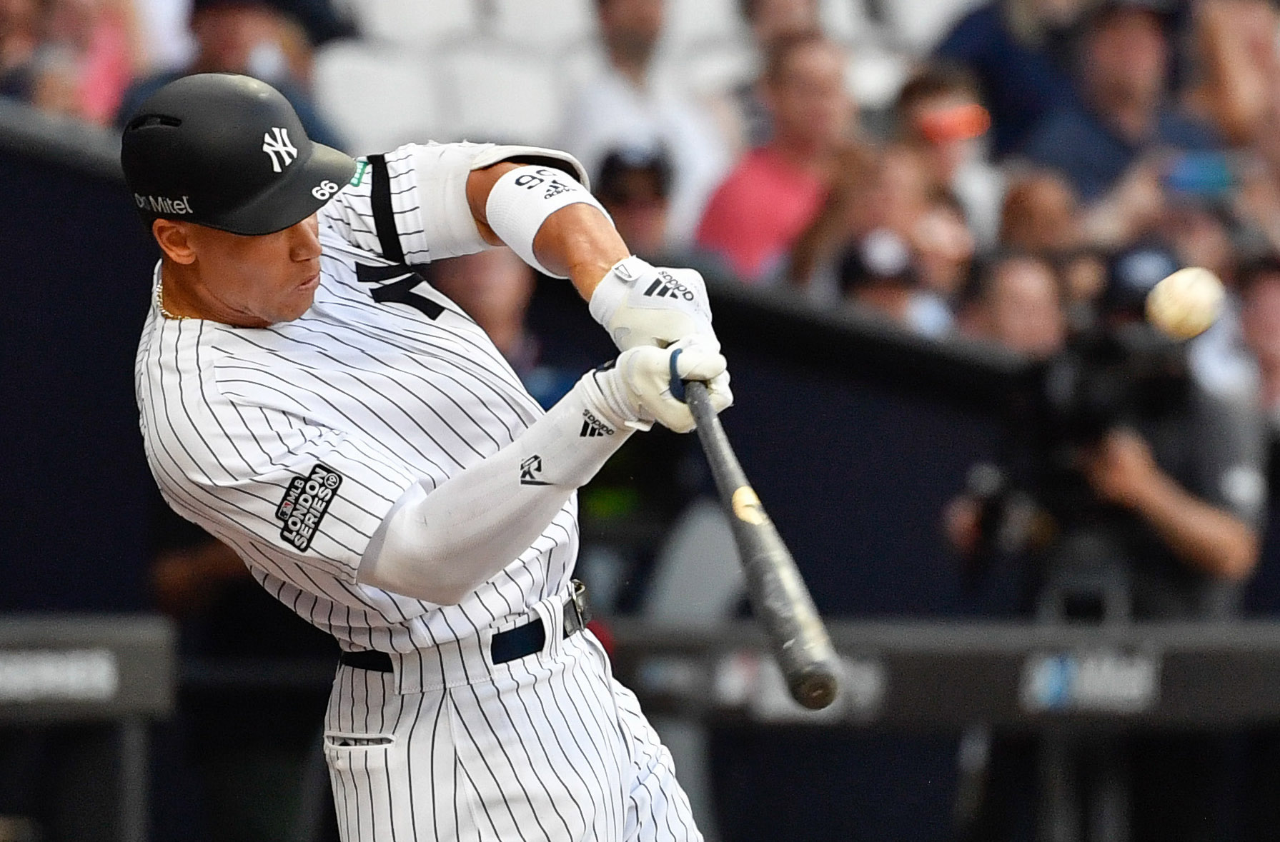 PHOTO: New York Yankees right fielder Aaron Judge hits a two run home run during the fourth inning against the Boston Red Sox at London Stadium on June 29, 2019.