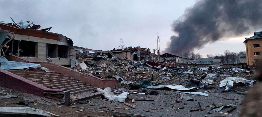 PHOTO: Smoke rises amid damaged buildings following an attack on the Yavoriv military base, near the border with Poland, in Yavoriv, Ukraine, March 13, 2022.