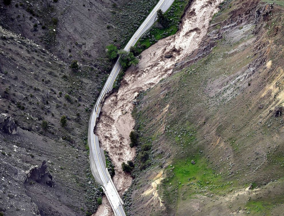 PHOTO: The highway is washed out trapping tourists in Gardiner, as historic flooding damages roads and bridges and floods homes along area rivers between Gardiner and Mammoth in Mont., June 13, 2022. 