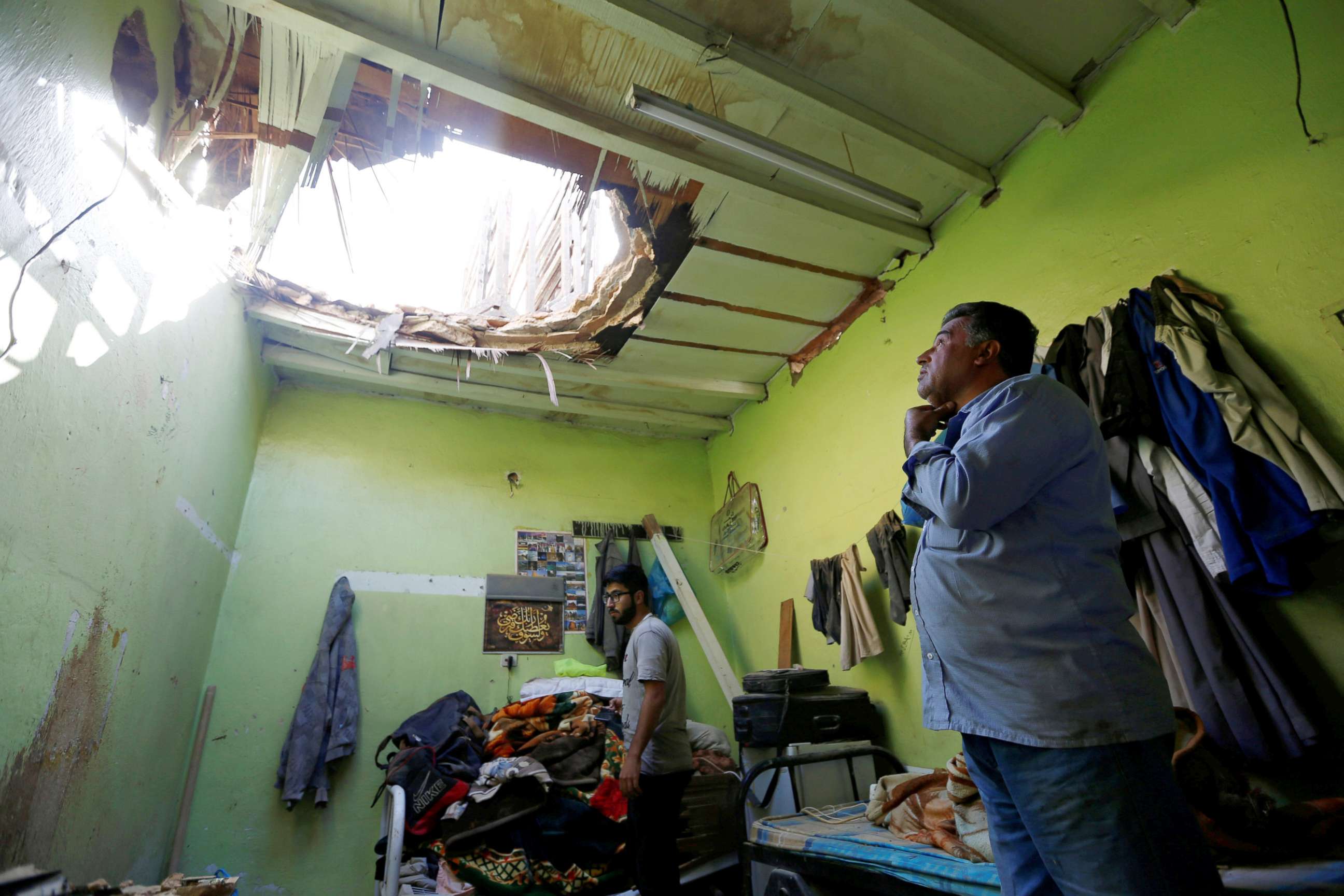 PHOTO: People check the damage after debris from ballistic missiles fired by Yemen's Houthi militia fell onto a house in Riyadh, Saudi Arabia, March 26, 2018.