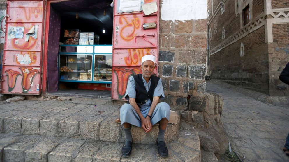 PHOTO: Lutf Ali al-Shahari sits on a pavement in Sanaa, Yemen, March 24, 2018. "Life in a time of war is tragedy, injustice, and destruction of houses and roads. Also, food is barely entering the country. Prices are high," he said.