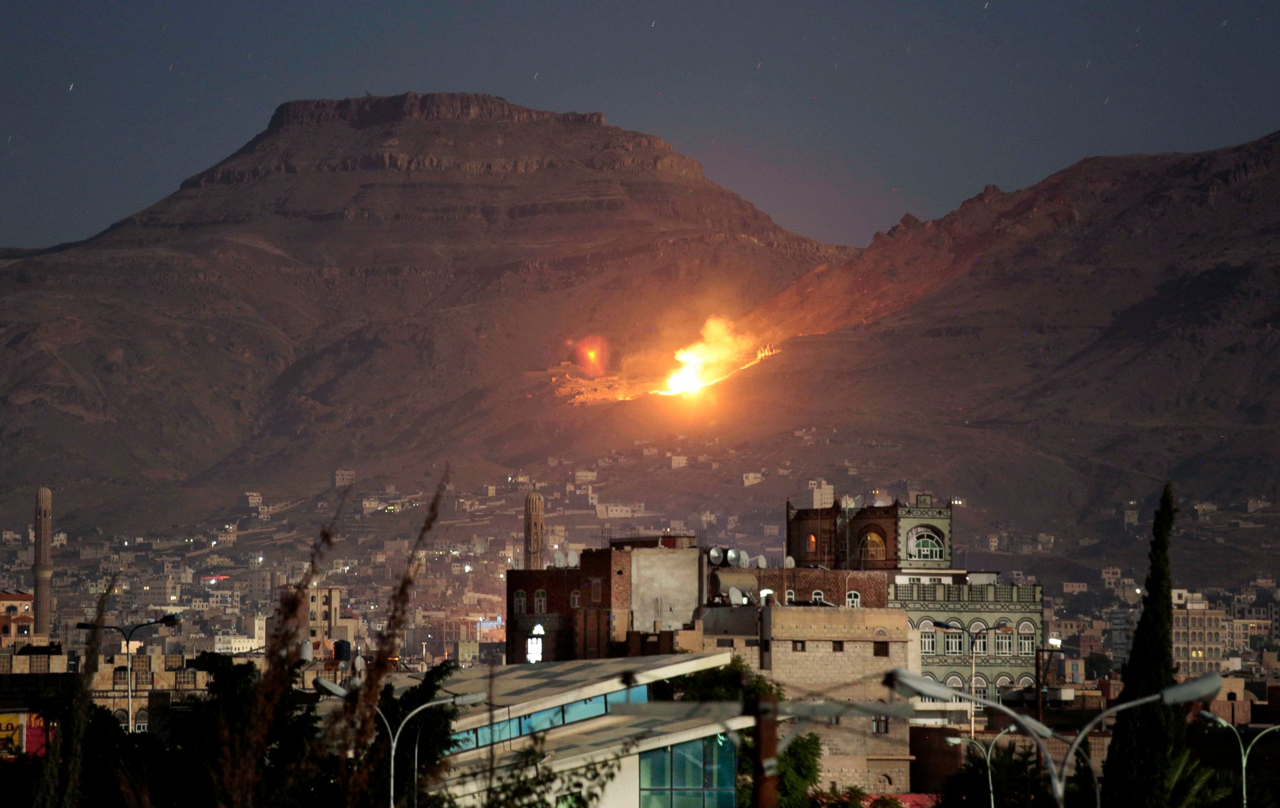 PHOTO: In this Oct. 14, 2016 file photo, fire and smoke rise after a Saudi-led airstrike hit a site believed to be one of the largest weapons depots on the outskirts of Yemen's capital, Sanaa.